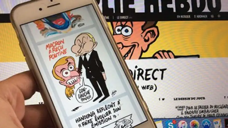 Лежать на месте: Charlie Hebdo изобразил Макрона щенком, кусающим Путина
