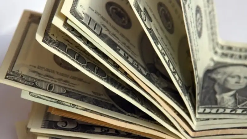 Тенге снова уступил доллару