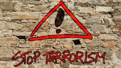 надпись на стене "стоп терроризм!"